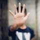Is Shame Really Courage In Disguise - Man holding hand up to block view for privacy. Counselling Services Melbourne