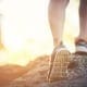 Mental Health Exercise - Person Jogging, Blurred Background, Showing Sneakers.