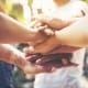 Mental Ask For Support Min - Group of people showing support and holding hands.